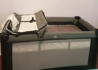 a small bed with an open box on top at Κατερινα in Athens
