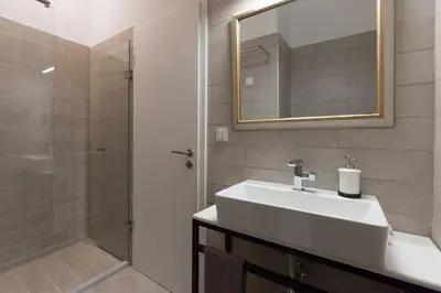 a bathroom with a sink and a shower at Troon of Athens House in Athens