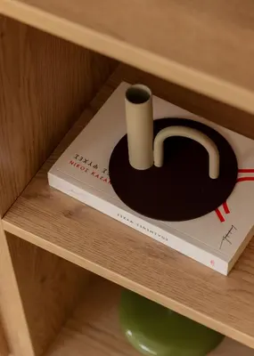 a book in a drawer with a roll of toilet paper at Urban Athéna Apartment,Pangrati in Athens