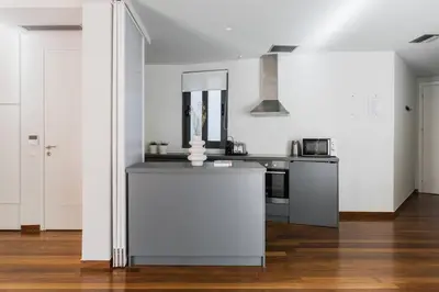 a kitchen with white walls and a counter top at The Hill by Zoia Living in Athens