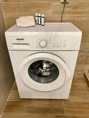 a white washer and dryer in a bathroom at Centrum Athens Apt. in Athens