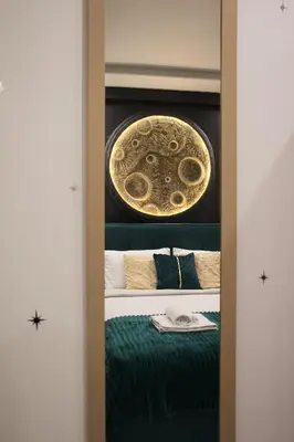 a room with a bed and a plate on the wall at Moon Haven Near Acropolis with 100Mbps WiFi in Athens