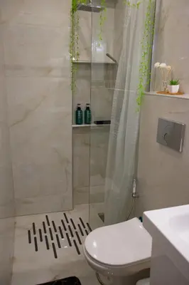 a bathroom with a shower with a toilet and a sink at Moon Haven Near Acropolis with 100Mbps WiFi in Athens