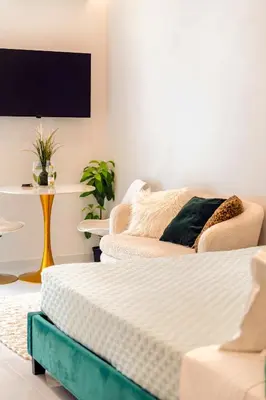 two mattresses in a room with a tv on the wall at Boutique3436 Luxury Apartment in Athens