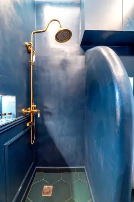 a bathroom with a shower with a blue wall at Boutique3436 Luxury Apartment in Athens