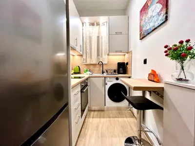 a small kitchen with a sink and a refrigerator at Elegant & Stylish 2nd Floor Flat - 3' from Metro in Athens