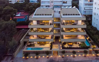 an aerial view of a building with a pool at OPULENT PENTHOUSE 1 in Vari
