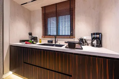 a kitchen with a sink and a counter top at OPULENT PENTHOUSE 1 in Vari