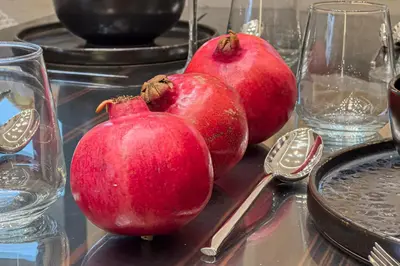 two red onions sitting on a glass table with spoons at OPULENT PENTHOUSE 1 in Vari