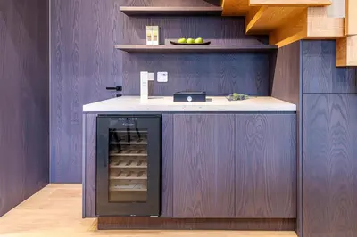 a kitchen with a counter with a wine cellar at OPULENT PENTHOUSE 1 in Vari