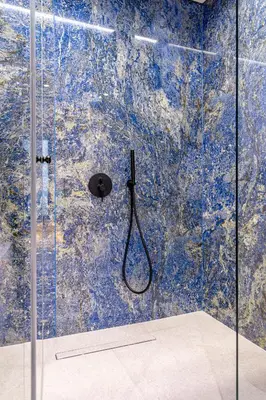 a bathroom with a shower with a glass door at OPULENT PENTHOUSE 1 in Vari