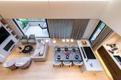 an overhead view of a living room with a table at OPULENT PENTHOUSE 1 in Vari
