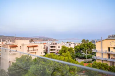 a view of a city with buildings at OPULENT PENTHOUSE 1 in Vari