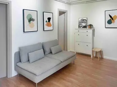 a living room with a gray couch in a room at Flat in Thissio in Athens