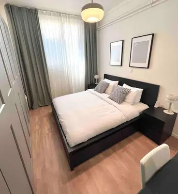a bedroom with a large bed with white sheets and pillows at Flat in Thissio in Athens