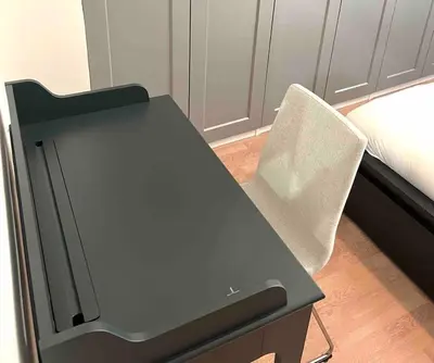 a desk with a chair next to a bed at Flat in Thissio in Athens