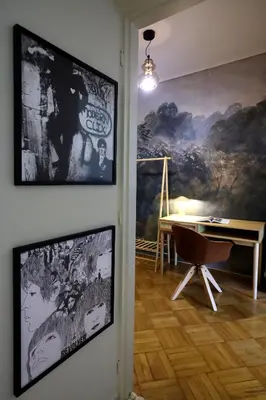 a room with a table and a painting on the wall at Cosy apartment in Glyfada in Athens