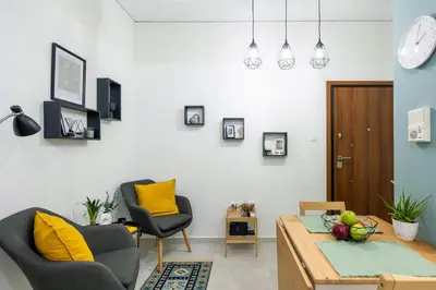 a living room with a table and two chairs at Athens Gem Retreat in Athens