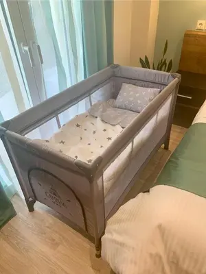 a small bed in a room next to a window at Mint Luxury Residence in Spáta