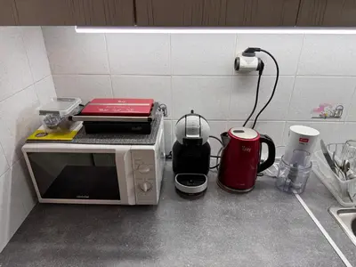 a kitchen counter with a microwave and a coffee maker at FeelAthens36 - very close to Syntagma, city center in Athens