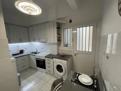 a kitchen with a washing machine and a sink at FeelAthens36 - very close to Syntagma, city center in Athens