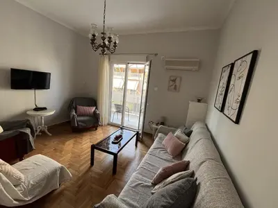 a living room with a couch and a table at FeelAthens36 - very close to Syntagma, city center in Athens