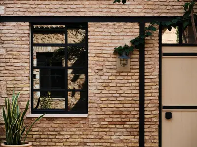 a brick house with a window and a door at Not Boutique Hotel in Athens
