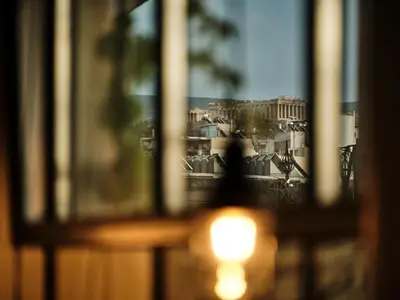 a view of the coliseum from a window at Not Boutique Hotel in Athens