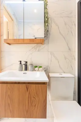 a bathroom with a sink and a toilet at Aiolos Rooftop JUCCUZI with view near the centre NEA smyrni in Athens