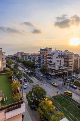 a city with buildings and a street with cars at Aiolos Rooftop JUCCUZI with view near the centre NEA smyrni in Athens