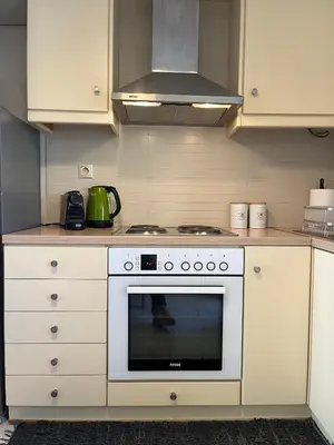 a kitchen with a white stove top oven at Bright 2 bdr Pagrati apartment in Athens