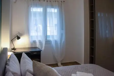 a bedroom with a bed and a window at Apartment in Athens Neos Kosmos in Athens