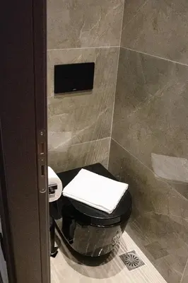 a bathroom with a toilet and a tiled shower at Apartment in Athens Neos Kosmos in Athens