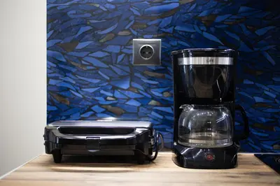 a blender and a toaster sitting on a counter at Cesily 2-Bedroom Apartment in Athens in Athens