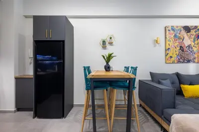 a living room with a table and a couch at Cesily 2-Bedroom Apartment in Athens in Athens