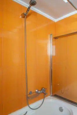 a shower in a bathroom with a tub at Comfort 1BR apt with amazing balcony at Piraeus in Piraeus