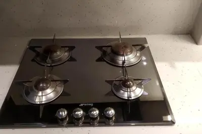 a stove top with four pots on top of it at Rsquared (Riviera Residence) in Aghia Marina
