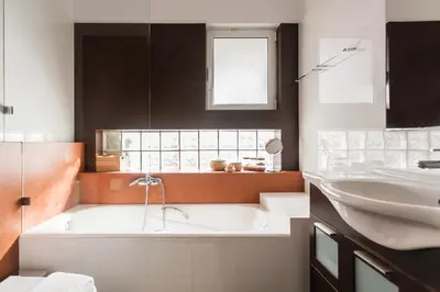 a bathroom with a bath tub and a sink at Elegant Maisonette 4BD Glyfada in Athens