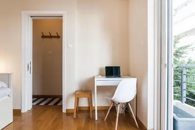 a room with a desk with a computer and a chair at Elegant Maisonette 4BD Glyfada in Athens