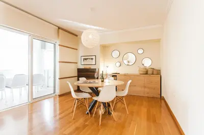 a dining room with a table and chairs at Elegant Maisonette 4BD Glyfada in Athens