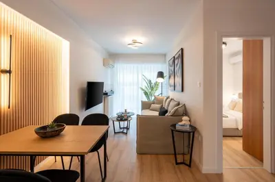 a living room with a couch and a table at Chic and Lavish Apartment in Athens in Athens