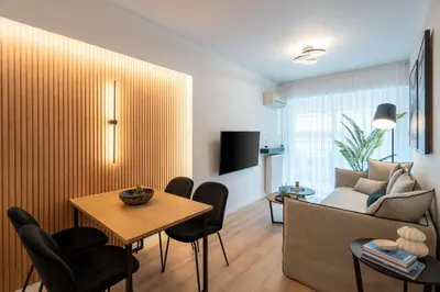 a living room with a couch and a table at Chic and Lavish Apartment in Athens in Athens