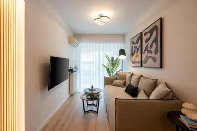 a living room with a couch and a table at Chic and Lavish Apartment in Athens in Athens