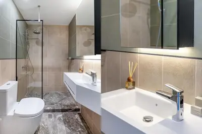 a bathroom with a sink and a toilet at Exceptional Living Lofts by UPSTREET in Athens