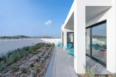 a house with a view of the water at Exceptional Living Lofts by UPSTREET in Athens