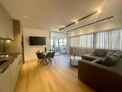 a living room with a couch and a table at BlueMotion - CruiseHub 2B in Piraeus