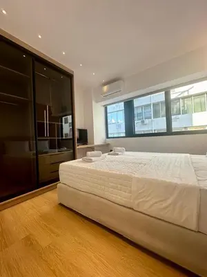 a bedroom with a large bed in a room at BlueMotion - CruiseHub 2B in Piraeus