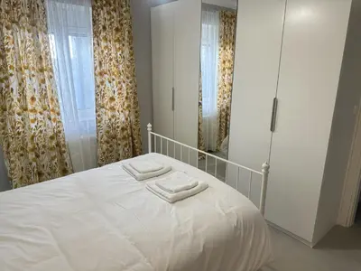 a bedroom with a bed with two towels on it at Seaside Luxury Apartments in Porto Rafti