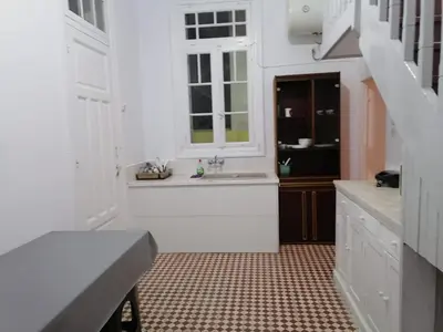 a white kitchen with a sink and a window at Комнаты отдыха in Athens
