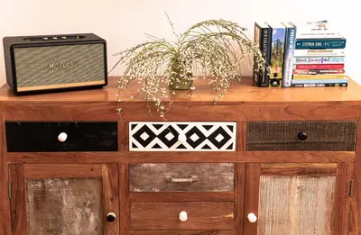 a wooden cabinet with a tv on top of it at Artsy Spacious Cozy Apartment in Glyfada Center in Athens